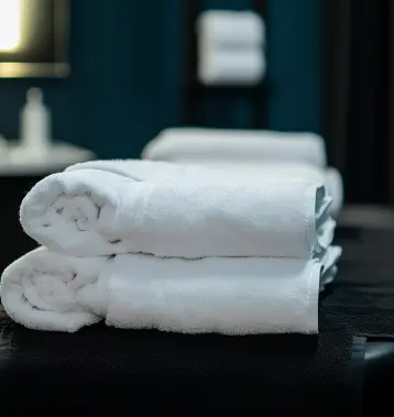 Towels in a physiotherapy room on massage bed